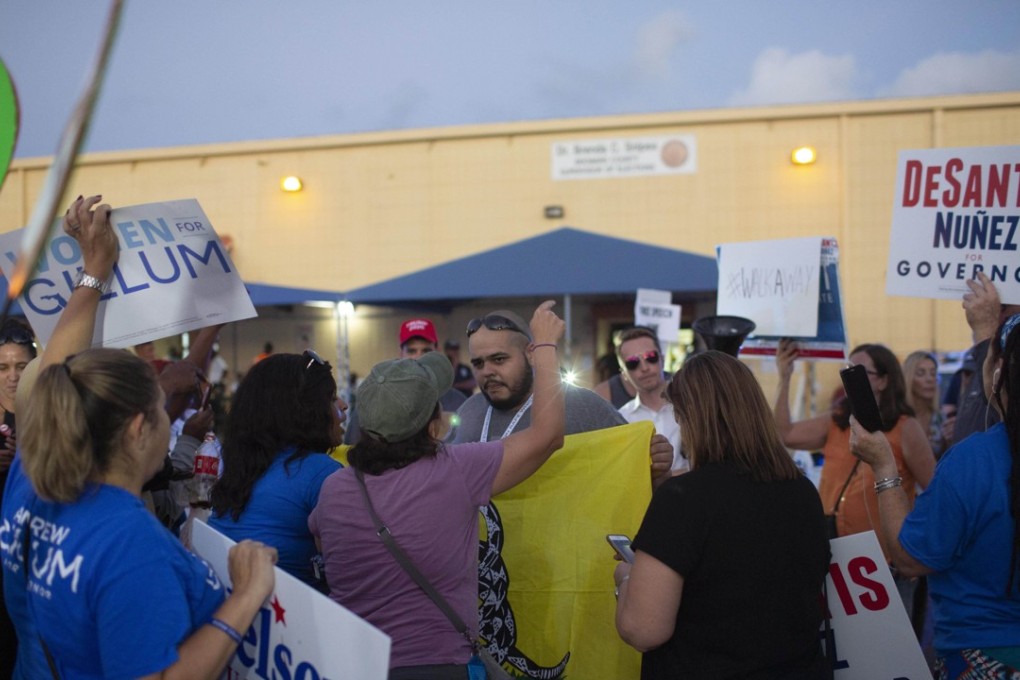Protesters confront each other outside the Broward County Supervisor of Elections office on November 9, 2018 in Lauderhill, Florida. Photo: AFP