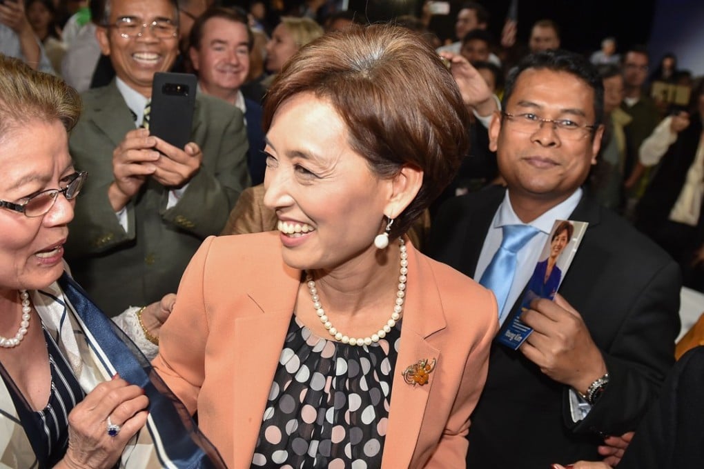 Young Kim is greeted by supporters as she arrives at an election night event. Photo: AFP