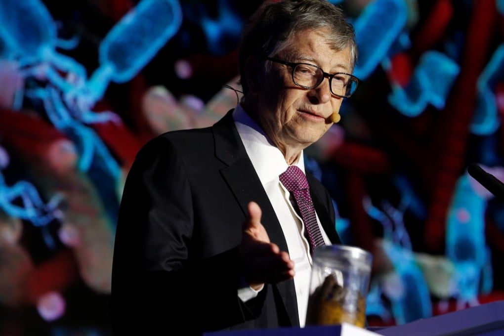 Microsoft founder Bill Gates speaking during the Reinvented Toilet Expo in Beijing on November 6, 2018, with a sealed jar containing human faeces on his podium. Photo: REUTERS