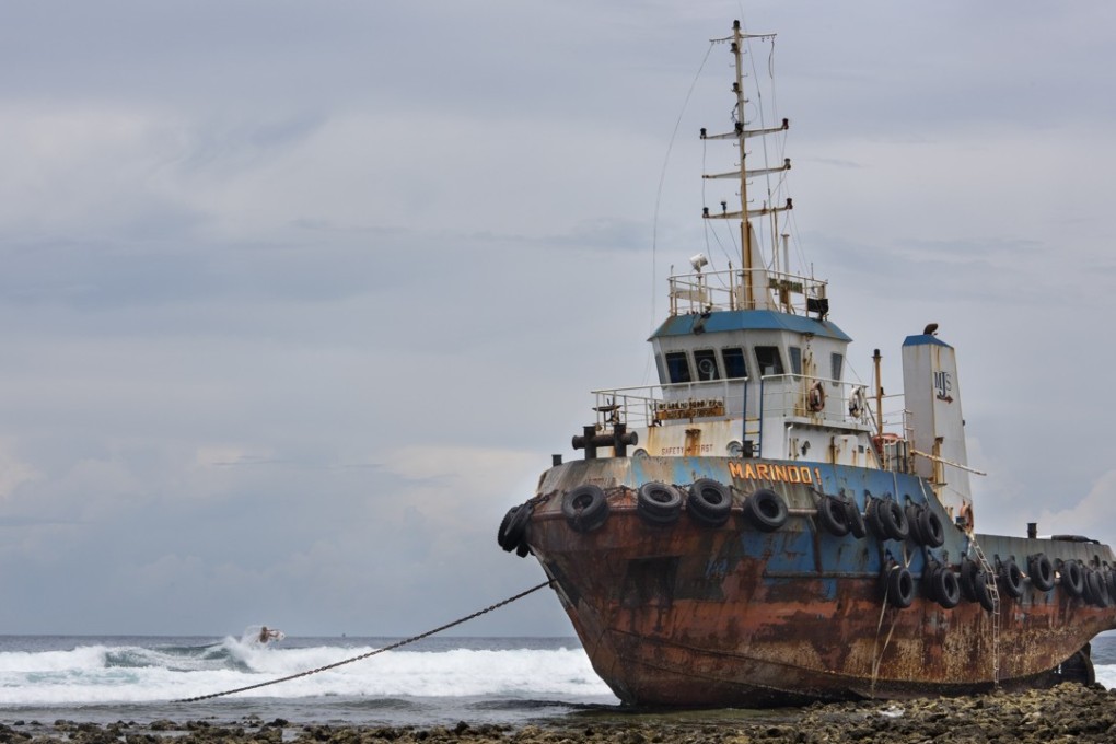 Tatiana Weston-Webb, from Brazil and ranked No 3 in the world, surfs at “Chambers” in front of a boat that ran aground on a reef. Pictures: Antony Dickson