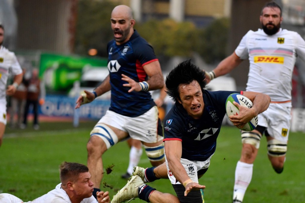 Hong Kong winger Salom Yiu Kam-shing is brought down near the try line in the repechage game against Germany in Marseille, France. Photo: AFP