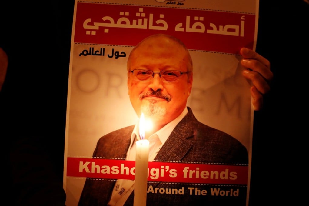 A demonstrator holds a poster with a picture of Jamal Khashoggi, outside the Saudi Arabian consulate in Istanbul on October 25. Khashoggi, who is believed to have been murdered, was last seen entering the consulate on October 2. Photo: Reuters