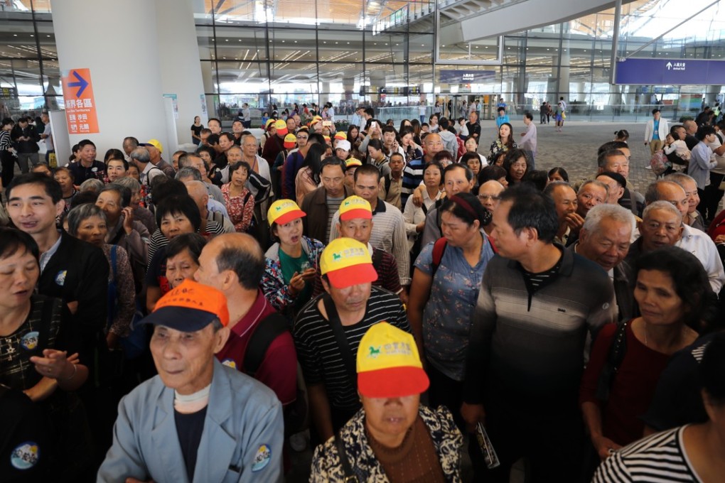 Tourists gather at the exit of immigration facilities on the Hong Kong-Zhuhai-Macau Bridge. Photo: Winson Wong
