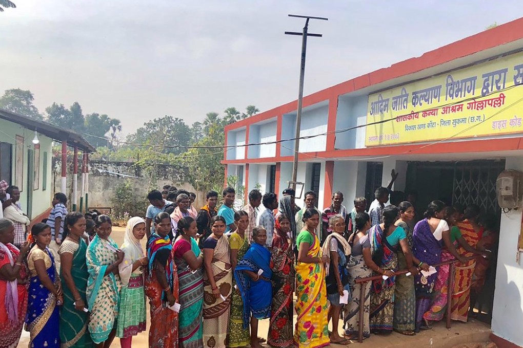 Voters line up at a polling station in Chhattisgarh state on Monday. Photo: AFP