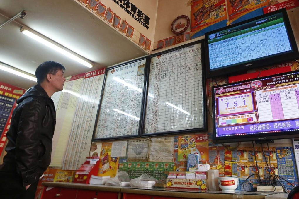 A customer at a Shanghai lottery story. The welfare and the sports lottery are the only legalised form of gambling on mainland China. Photo: Reuters