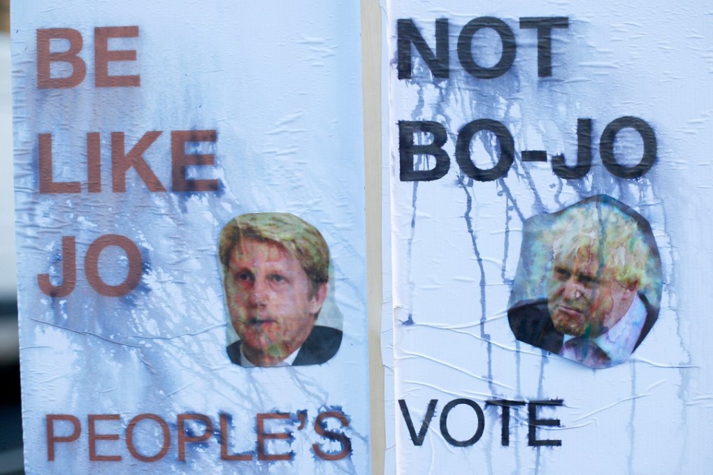 A rain damaged placard in favour of a second Brexit referendum features pictures of former Foreign Secretary Boris Johnson, and former Transport Minister Jo Johnson, in Westminster, London. Photo: Reuters