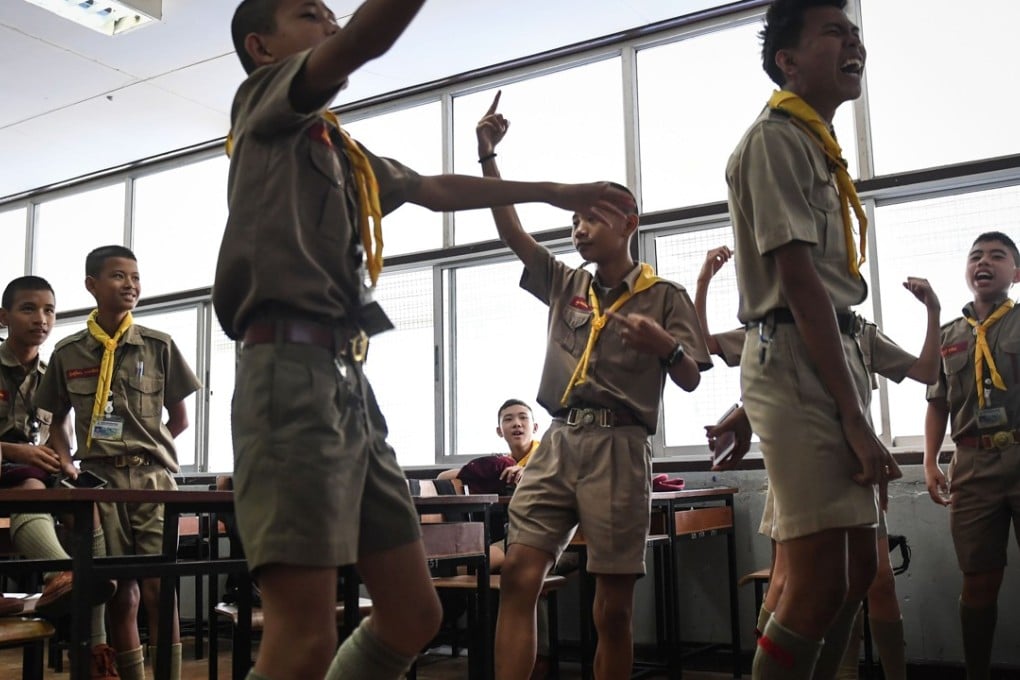 Students singing along with 17-year-old rapper Elevenfinger’s rap during a music club session at a government school in Bangkok. Photo: AFP