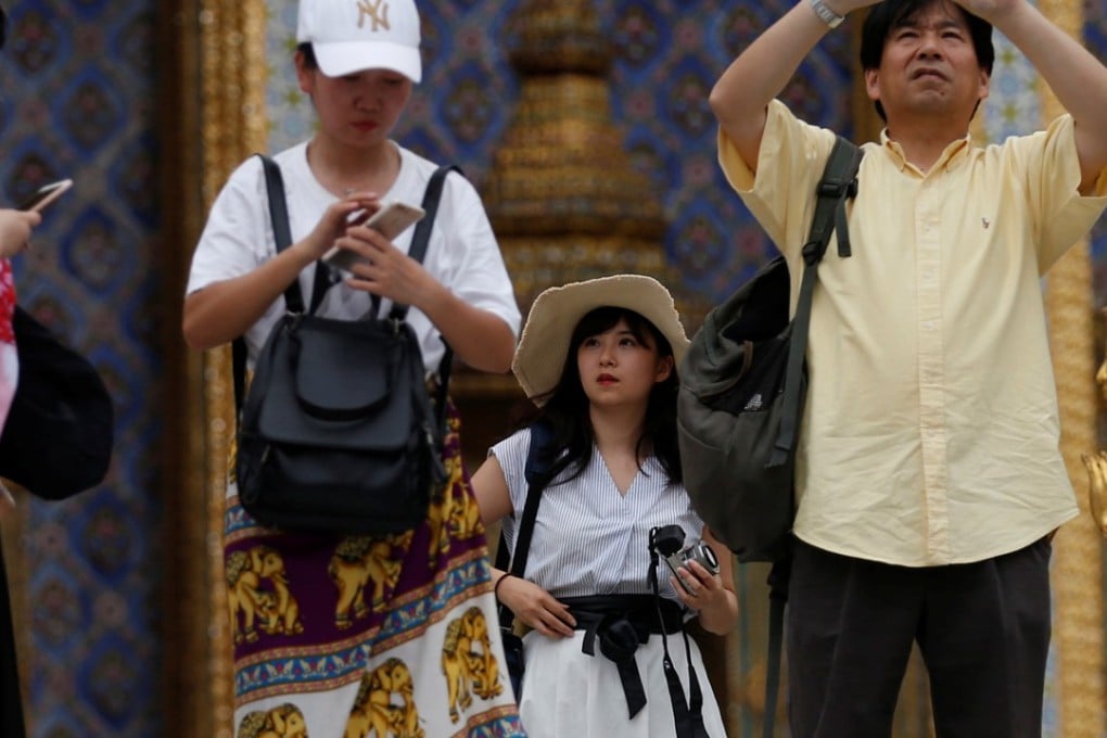 Chinese tourists at Wat Phra Kaew in Bangkok, Thailand. Picture: Reuters