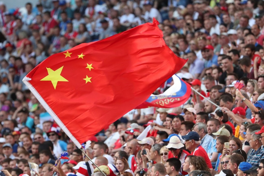 A fan waves the Chinese flag during the Fifa World Cup 2018 group match between Costa Rica and Serbia in Samara. Photo: EPA