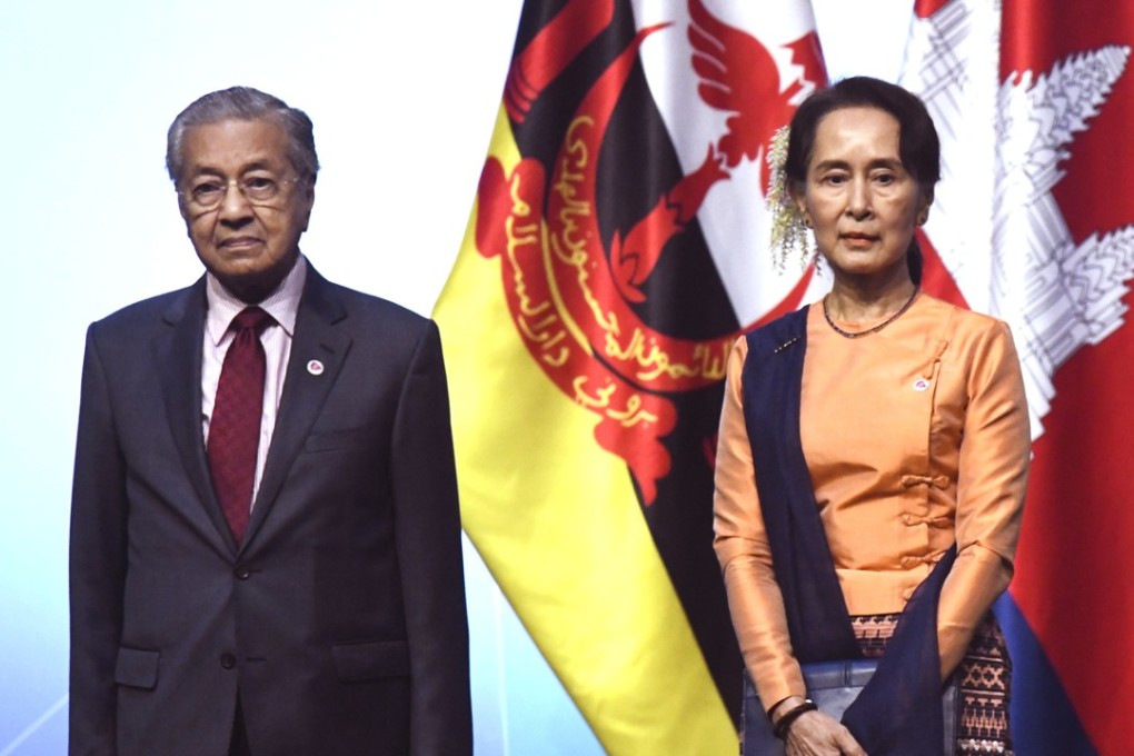 Malaysia’s Prime Minister Mahathir Mohamad and Myanmar State Counsellor Aung San Suu Kyi pose for a group photo with other leaders at the opening ceremony of the 33rd Asean summit. Photo: AFP