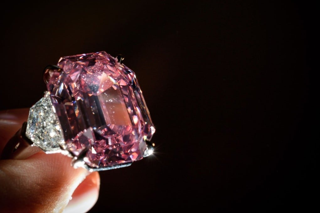 The Pink Legacy, a 18.96 carat fancy vivid pink diamond once owned by Oppenheimer family is displayed last Thursday during a press preview ahead of sales by Christie's auction house in Geneva. Photo: Agence France-Presse