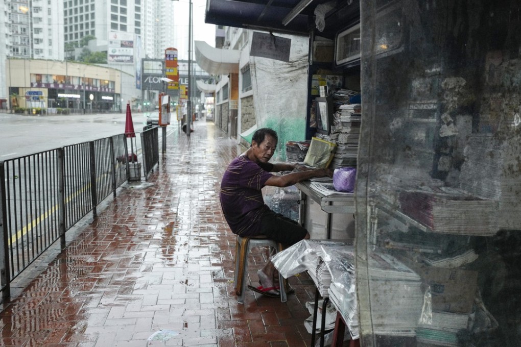 A news-stand in Kornhill stays open, as No 10 signal Typhoon Hato batters Hong Kong on August 23, 2017. The Basic Law says Hong Kong residents shall have freedom of speech, of the press and of publication. Photo: Robert Ng