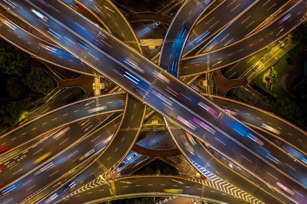 An aerial view of traffic in downtown Shanghai. The Chinese government is adapting quickly and quietly to blockchain, knowing that it can accelerate the next financial revolution. Photo: AFP