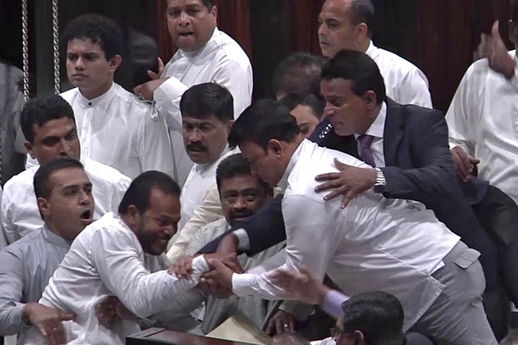 An MP was injured after trying to rip out the speaker’s microphone. Photo: AP