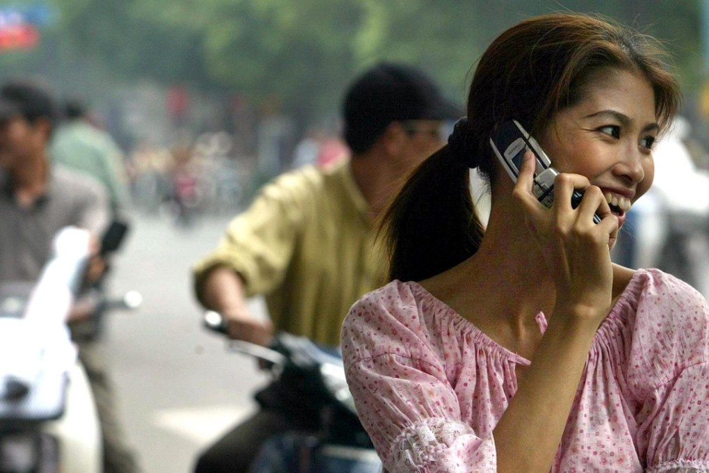 A woman talks on her mobile phone in Hanoi. Photo AFP