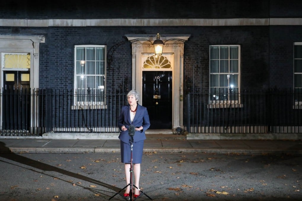 UK Prime Minister Theresa May delivers a statement outside 10 Downing Street in London on Wednesday following a marathon special session of Cabinet to discuss the Brexit deal. Photo: Bloomberg