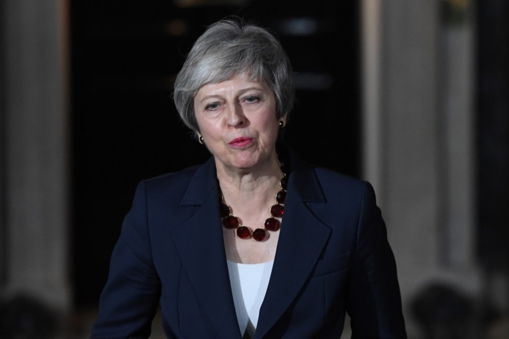 British Prime Minister Theresa May’s Brexit secretary and other ministers quit one by one on Thursday, striking at the heart of a draft divorce deal with the European Union she is struggling to save. Photo: EPA