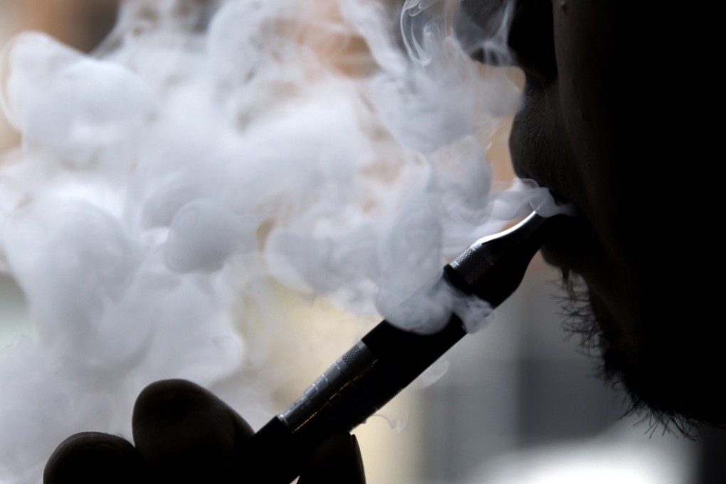 A man smokes an electronic cigarette in Chicago in this file photo. Photo: AP