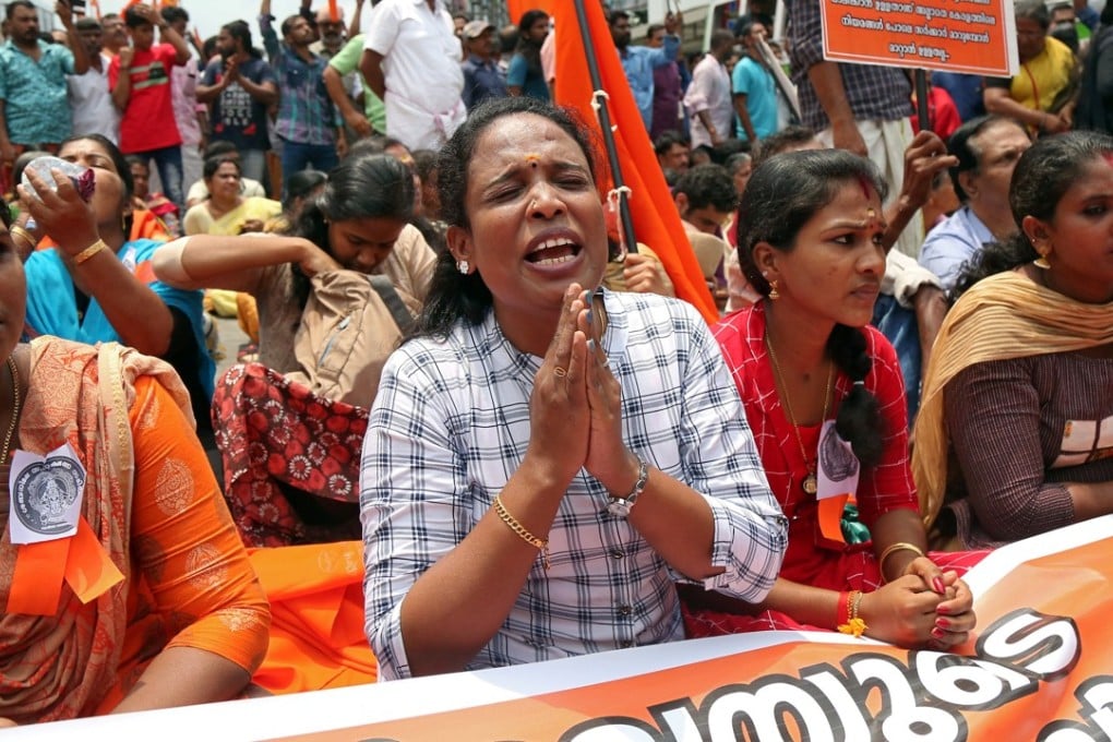 A woman chants hymns during a protest called by various Hindu organisations against the lifting of a ban preventing women of menstruating age from entering the Sabarimala temple in India. Photo: Reuters