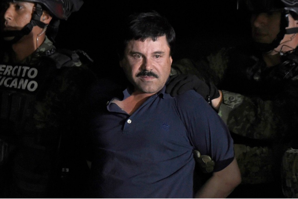 Drug kingpin Joaquin ‘El Chapo’ Guzman being escorted to a helicopter at Mexico airport in January 2016. Photo: AFP