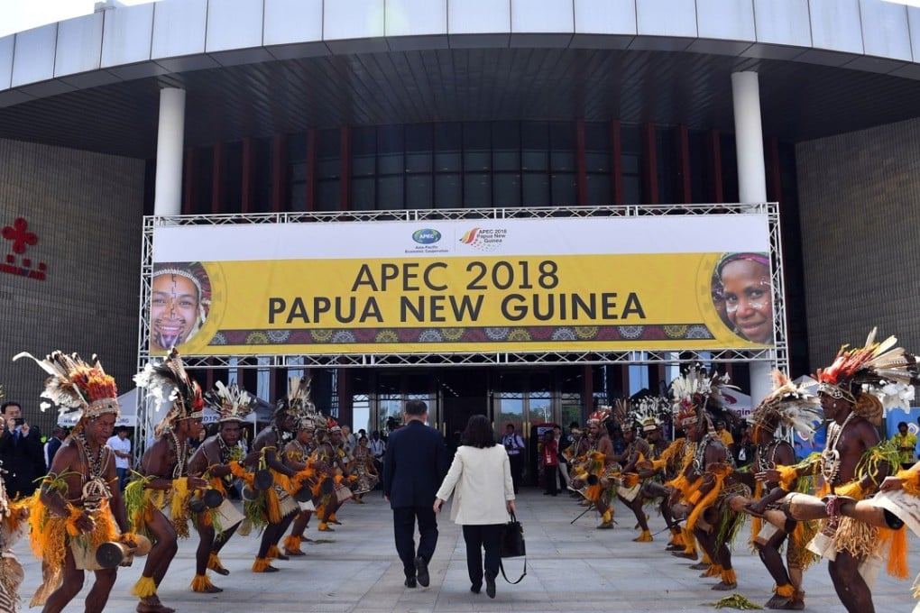 Performers in traditional costumes and headdress welcome delegates and ministers to the international convention centre for the 30th Asia-Pacific Economic Cooperation ministerial meeting in Port Moresby on November 15. Photo: AFP
