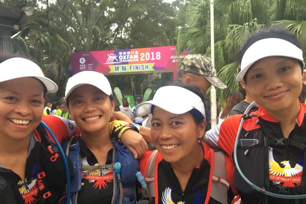 Maid of Heart and Sole at the finish line of the Oxfam Trailwalker. The team of domestic helpers beat their target time by three hours. Photo: Andrew Mullen