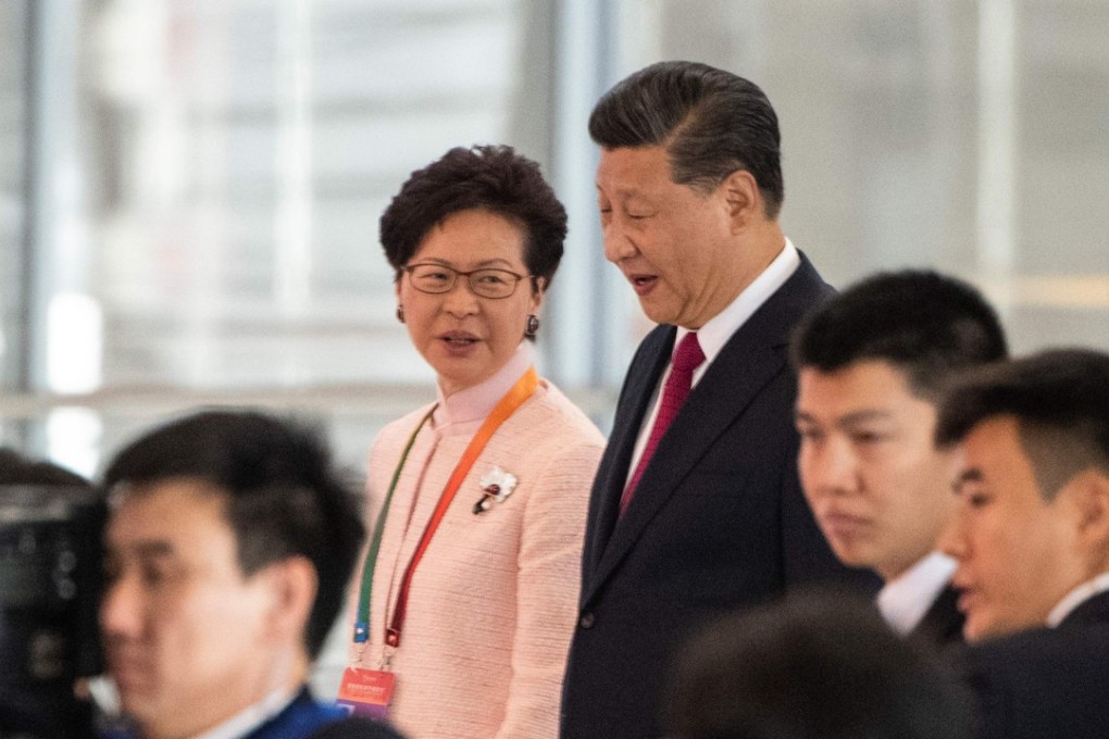 Hong Kong's Chief Executive Carrie Lam and China's President Xi Jinping arrive at the opening ceremony of the Hong Kong-Zhuhai-Macau Bridge at Zhuhai port on October 23. Photo: AFP