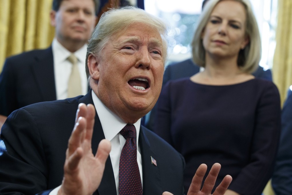 US President Donald Trump speaks to reporters about the investigation of special counsel Robert Mueller during a signing ceremony for the Cybersecurity and Infrastructure Security Agency Act, in the Oval Office of the White House, on Friday. Photo: AP