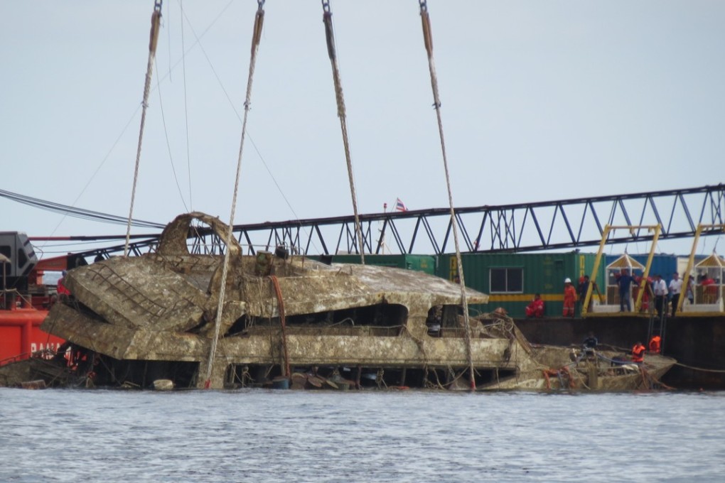 A crane boat raising the tour boat Phoenix from the sea floorin Phuket, Thailand, on Saturday. The boat sank over four months ago in rough weather killing 47 Chinese tourists. Photo: AP
