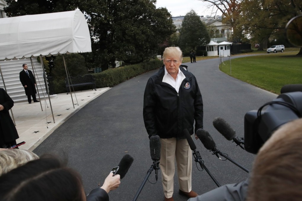 President Donald Trump listens to questions from the media as he leaves the White House. Photo: AP Photo