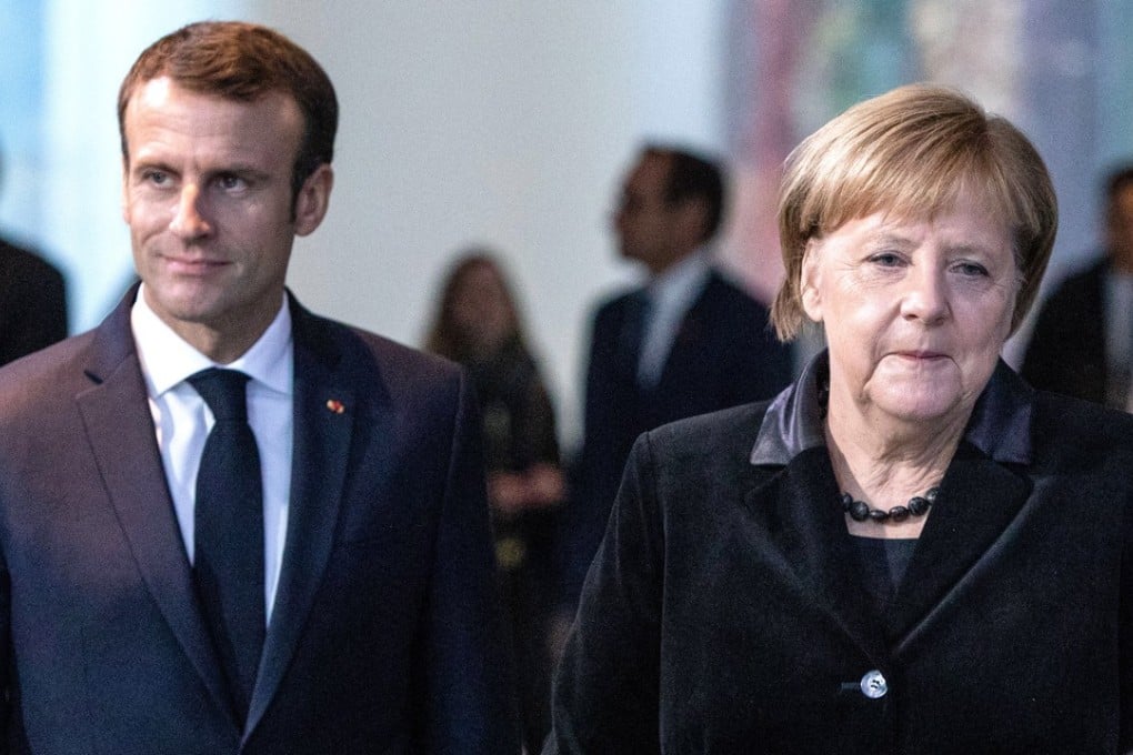 German Chancellor Angela Merkel (right) and French President Emmanuel Macron, arrive for a joint press conference at the German Chancellery in Berlin. Photo: EPA-EFE