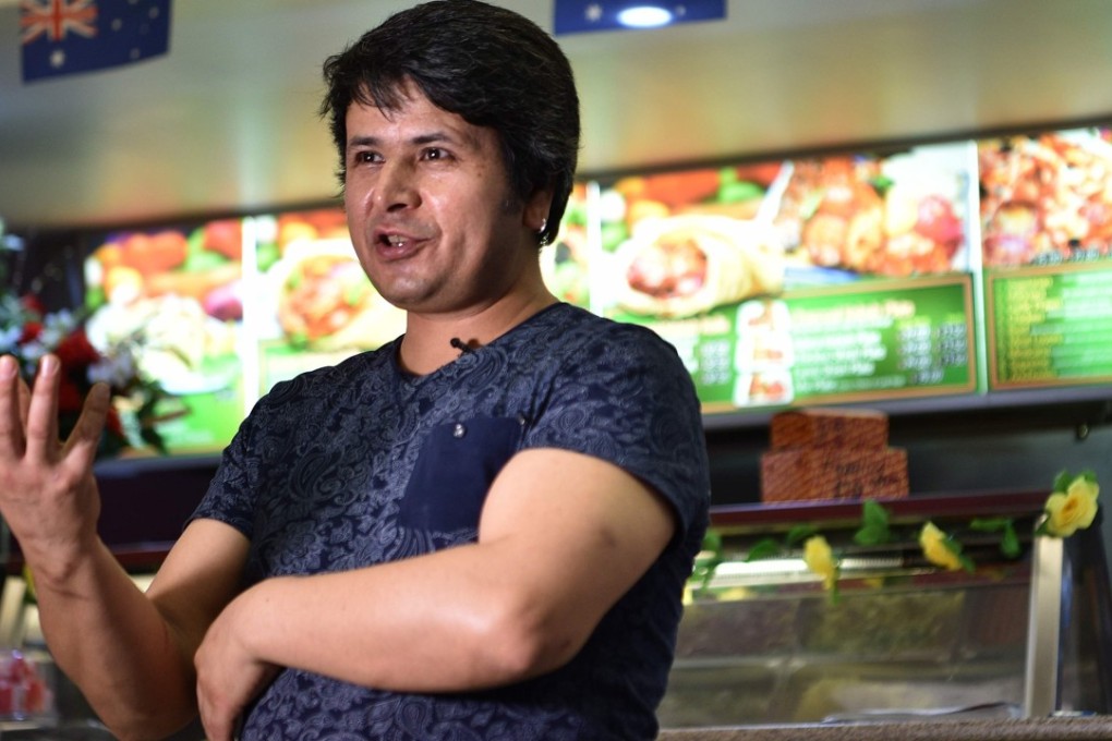 Hazara refugee Ali in his Afghan Friendship Restaurant in Griffith, a tribute to the warm welcome he says he received after moving to the town five years ago. Photo: AFP