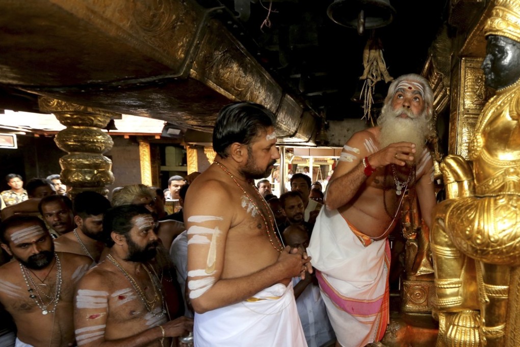 Priests prepare to open the sanctum sanctorum of the Sabarimala temple, one of the world's largest Hindu pilgrimage sites, Kerala state, India. Photo: AP