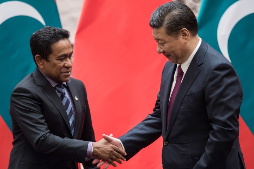 China's President Xi Jinping and Maldives' President Abdullah Yameen shake hands at the Great Hall of the People in Beijing after their trade deal is signed. An aide to Ibrahim Mohamed Solih, new president of the island nation of 400,000 people, says his country wants out of the accord. Photo: AFP