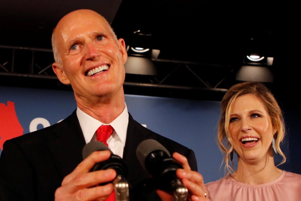 Rick Scott accompanied by his daughter Allison Guimard as he addresses supporters at his midterm election night party in Naples, Florida. Photo: Reuters