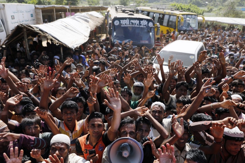 Rohingya refugees shout slogans during a protest against a disputed repatriation programme at a refugee camp near Teknaf, Bangladesh. Photo: EPA