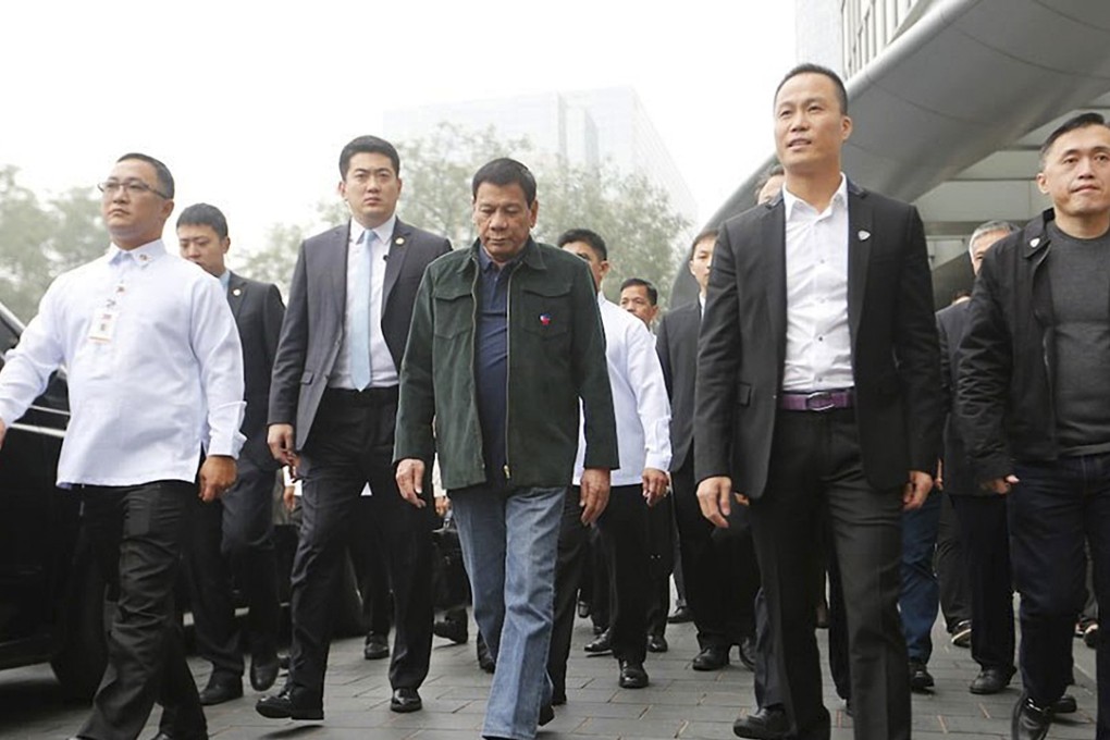 President Rodrigo Duterte accompanied by businessman Michael Yang (second right) in Beijing. Photo: Reuters