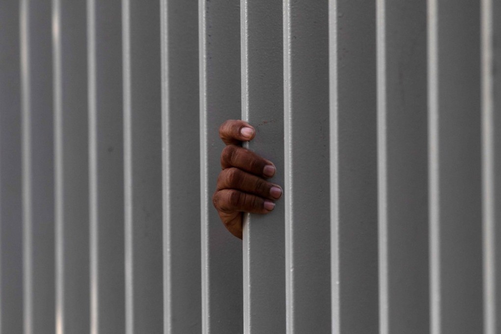 A migrant travelling with the Central American migrants' caravan towards the United States in hopes of a better life, awaits for a cup of hot chocolate inside a shelter in Tijuana, Mexico. Photo: AFP