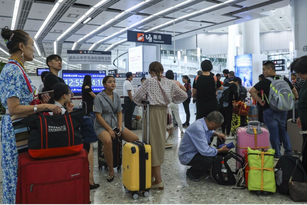 Passengers queue up to buy tickets at the West Kowloon High-Speed Rail Link Terminus. Photo: Sam Tsang