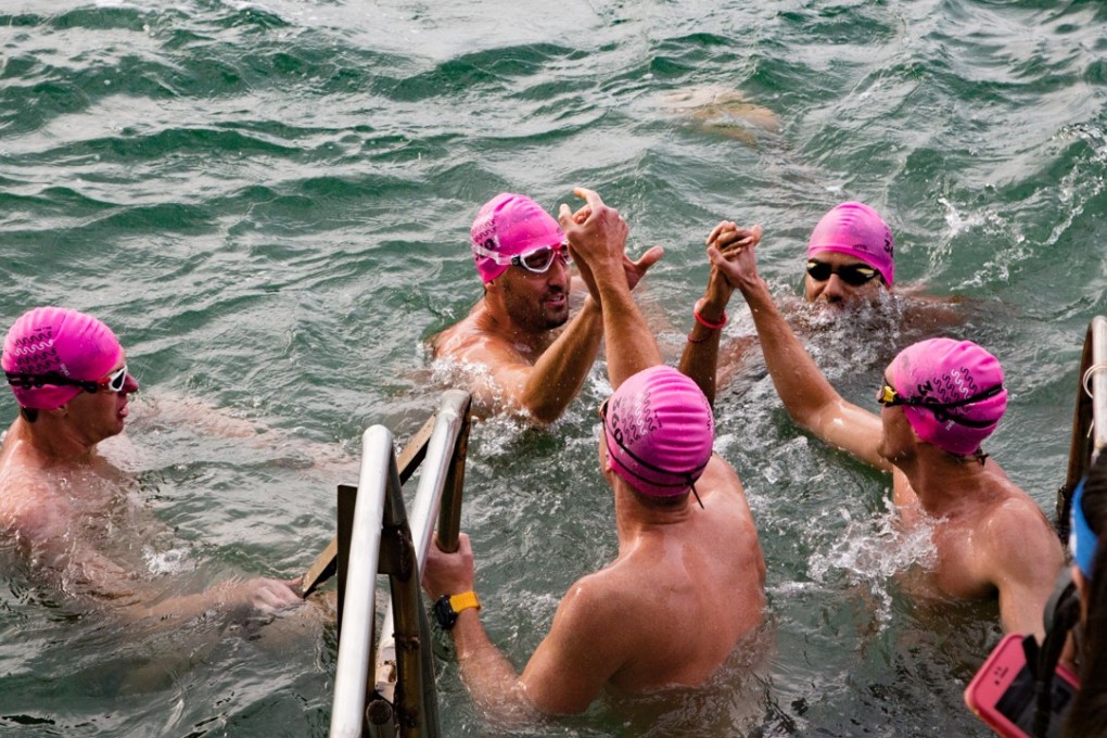The Drifters celebrate their relay swim around Hong Kong Island. Photo: Maxime Vanhol