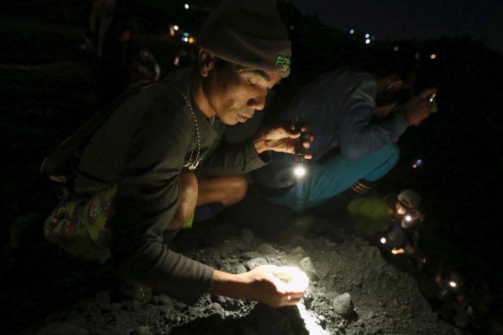 Illegal scavengers are often tolerated by Myanmar’s big jade mining companies once the machines fall silent. Photo: Reuters
