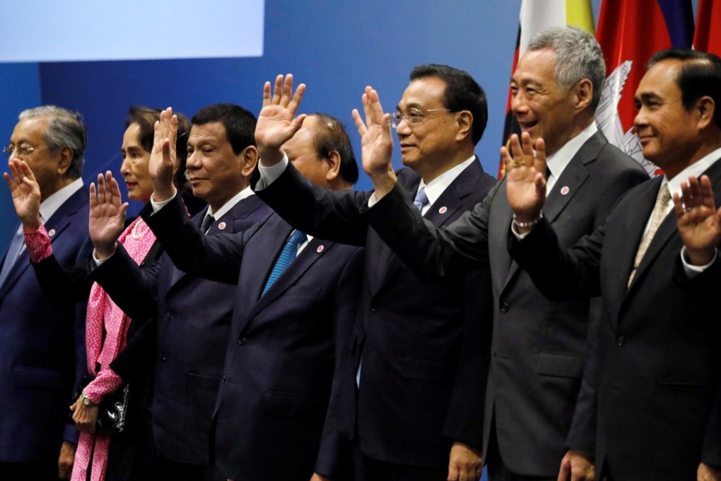 China’s Premier Li Keqiang (third from right) poses with Association of Southeast Asian Nation leaders at the Asean-China Summit in Singapore on November 14. Li signed an upgraded version of the China-Singapore free-trade agreement during his visit. Photo: Reuters