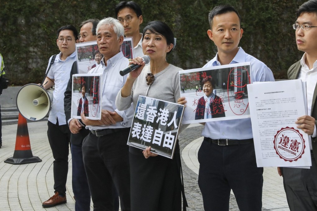 Pro-democracy camp convenor Claudia Mo Man-ching (centre) is flanked by allies as she demands restrictions on the square be lifted. Photo: K.Y. Cheng