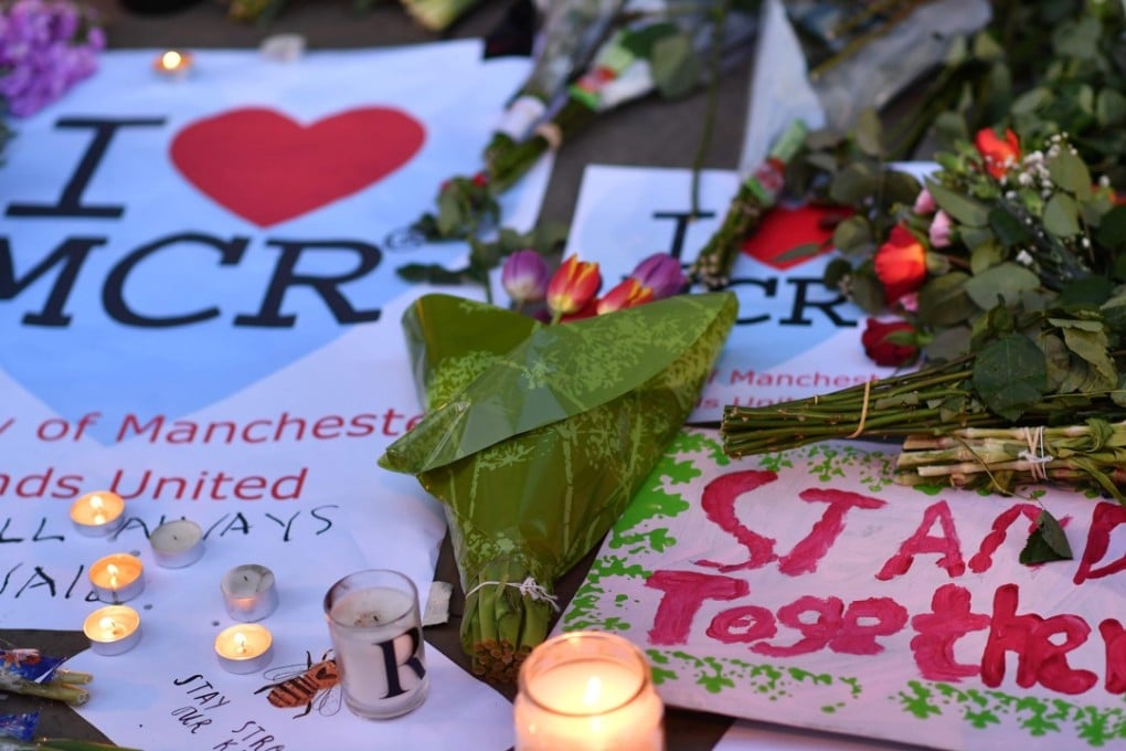 In this file photo taken on May 23, 2017 messages and floral tributes are seen in Albert Square in Manchester, northwest England, in solidarity with those killed and injured in the May 22 terror attack at the Ariana Grande concert at the Manchester Arena. Photo: AFP