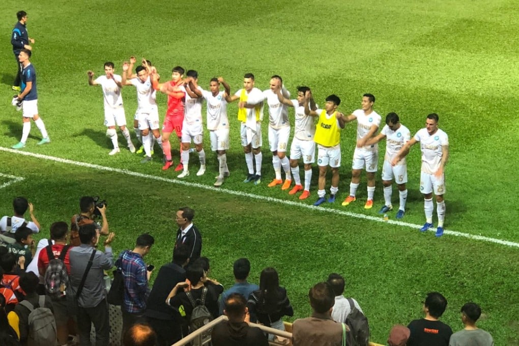 Hong Kong R&F’s players applaud their fans after ending Kitchee’s 31-game unbeaten league run at Mong Kok Stadium. Photo: Jonathan White
