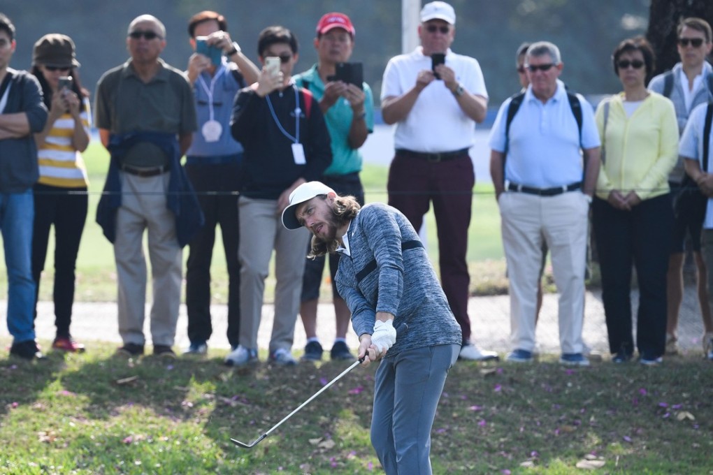 Tommy Fleetwood chips in front of the gallery. Photos: Richard Castka