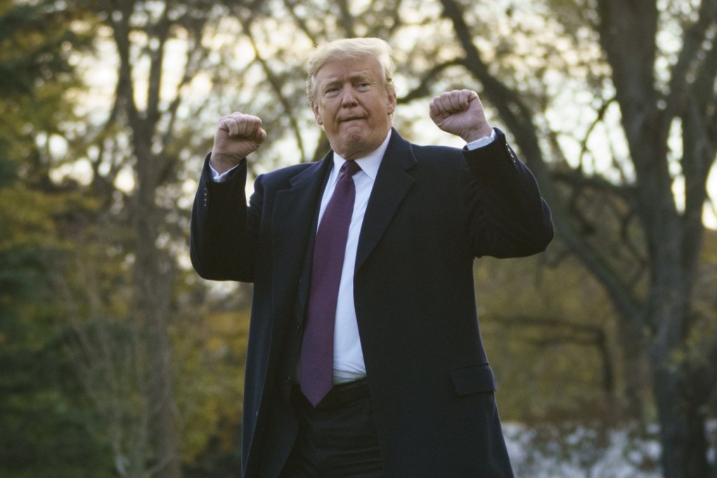 Donald Trump gestures as he walks to Marine One following a meeting with the media, at the White House on November 20. Photo: AP