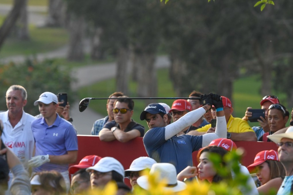 Fans watch Aaron Rai hit a tee shot at Fanling. Photos: Richard Castka
