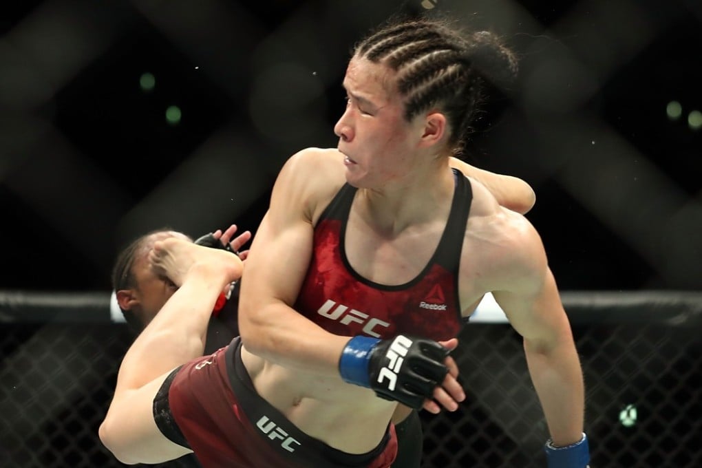Zhang Weili kicks Danielle Taylor in the face during their featherweight bout at UFC 227 in August 2018. Photo: AFP
