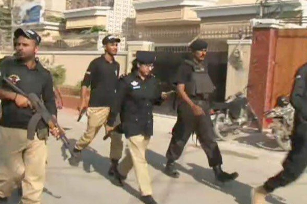 Policewoman Suhai Aziz Talpur helping secure the Chinese consulate attack in Karachi. Photo: Handout